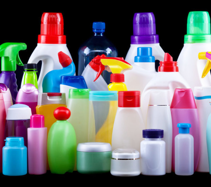 Usual plastic bottles from a household isolated on black - pollution and environment concept